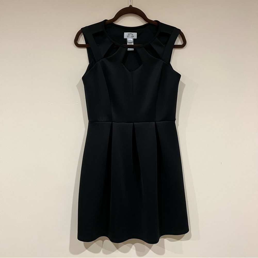 black dress with neckline cutouts